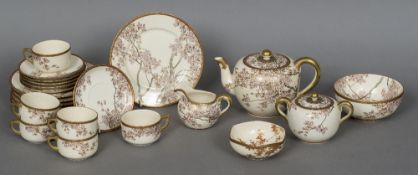 A finely painted Satsuma six place setting tea set Each piece decorated with birds and blossoming