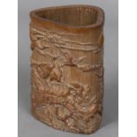 A Chinese carved bamboo brush pot Worked with birds in a continuous landscape. 14 cm high.