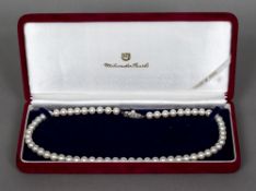 A boxed Mikimoto cultured pearl necklace 40 cm long;