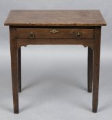 An 18th century oak side table The plank rectangular top above a single frieze drawer with brass