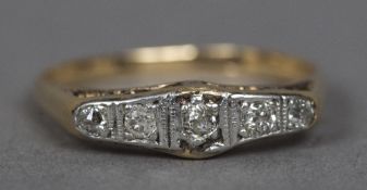 An 18 ct gold diamond five stone ring Of lozenge form.