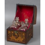A Dutch marquetry inlaid liqueur decanter box The domed hinged cover enclosing four gilt decorated