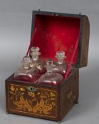 A Dutch marquetry inlaid liqueur decanter box The domed hinged cover enclosing four gilt decorated