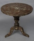 A late 19th century Chinese mother-of-pearl inlaid hardwood tripod table The circular top profusely