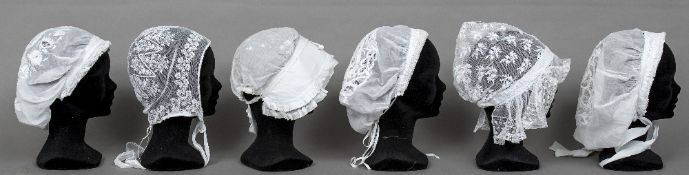 Six 19th century Nottingham lace bonnets Various sizes.