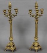 A pair of 19th century ormolu candelabra Each with four acanthus cast branches above the three