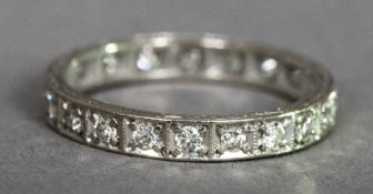 An 18 ct white gold diamond set eternity ring CONDITION REPORTS: Generally in good