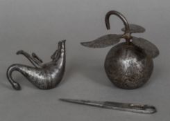 A 19th century Qajar steel weight Formed as an apple with engraved bird decoration;
