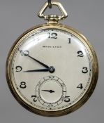 An unmarked gold Hamilton pocket watch The silvered dial with Arabic numerals and subsidiary sweep