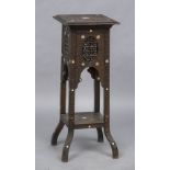 A Liberty type Moorish jardiniere stand Typically carved with ebony and mother-of-pearl star form