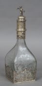 A Continental white metal mounted etched glass decanter Of square section,