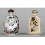 Two Chinese inside painted glass snuff bottles and stoppers One decorated with cranes,