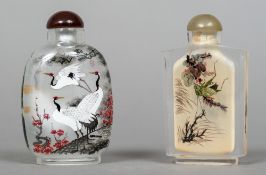 Two Chinese inside painted glass snuff bottles and stoppers One decorated with cranes,