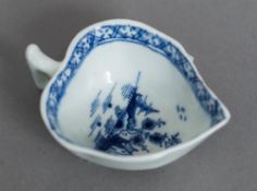 An 18th century Lowestoft porcelain butter boat The moulded body decorated with the Tree and House