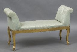 A late 19th century upholstered carved giltwood window seat Of typical twin end form,