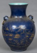 A Chinese porcelain twin handled vase Of baluster form with ring handles,