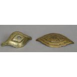Two 19th century Eastern brass buckles Both with engraved decoration, one set with a clear stone.