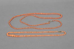 Two coral bead necklaces The larger 102 cm long.