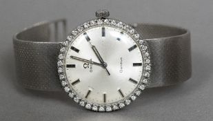 An 18 ct white gold Omega gentleman's wristwatch The silvered dial inscribed Omega Geneve within a