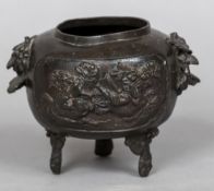 A Ming patinated bronze censor Of squat ovoid form with bird filled vignettes. 11 cm high.