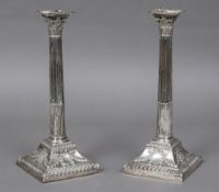 A pair of George III silver Corinthian column candlesticks, hallmarked London 1772,