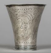 An early Continental white metal beaker, with indistinct marks Of trumpet form,