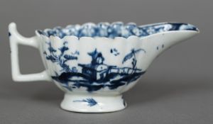 An 18th century Lowestoft porcelain cream boat With scalloped rim and ribbed body decorated with