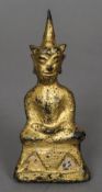 An early gilt bronze model of Buddha Typically modelled,