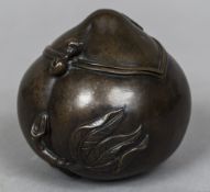 A Chinese bronze censor Modelled as a peach with hinged cover. 11 cm high.