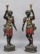 A pair of late 19th/early 20th century Venetian Blackamoor figures Each typically modelled wearing