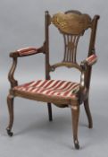 A 19th century brass inlaid rosewood lady's open armchair The deep serpentine top rail above the