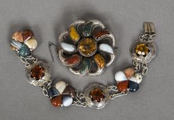 A Scottish unmarked silver specimen agate and citrine set brooch Of pierced scrolling target form;