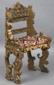 A 17th century baroque carved giltwood chair With pierced back and angel form supports,