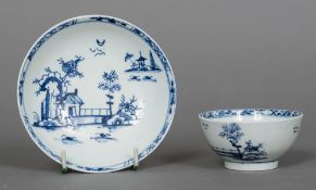 An 18th century Lowestoft porcelain tea bowl and saucer Decorated with the Long Fence pattern,