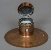 An Arts and Crafts copper inkwell Of Capstan type form, with mother-of-pearl mounts,