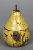 A carved wood and painted pear shaped caddy Of typical form, with hinged cover. 16 cm high.