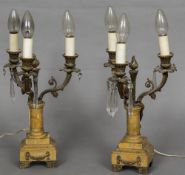 A pair of 19th century gilt bronze mounted sienna marble three branch candelabra (fitted for