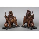 A pair of late 19th/early 20th century Chinese carved wooden models of elephants Each mounted with