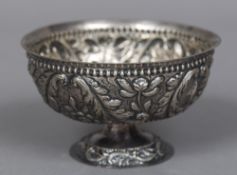 A Continental white metal footed bowl With embossed scrolling decoration,