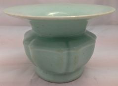 A Chinese porcelain celadon glazed Zhadou The flared rim above a lobed body,