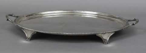 A George III silver twin handled tray, hallmarked London 1802,