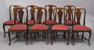 A set of eight George III mahogany dining chairs Each shaped top rail above a central splat above