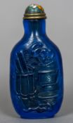 A Chinese carved blue Peking glass snuff bottle With cloisonne lid,