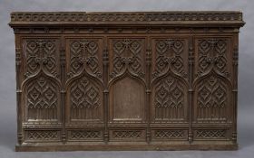 A Victorian carved oak church panel Carved with floral rosettes and Gothic arches. 176.