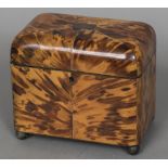 An early 19th century tortoiseshell tea caddy The hinged cover enclosing two lidded compartments,