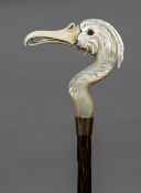 A Victorian ivory and mother-of-pearl handled parasol The handle carved from mother-of-pearl as an