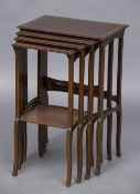 An Edwardian mahogany quartetto nest of tables Each moulded rectangular top with crossbanded inlays