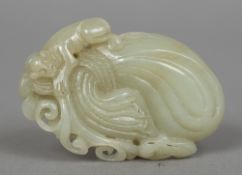 A Chinese jade pebble Carved as a monkey on a sack. 7 cm high.