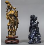 A Chinese carved tiger's eye model of Guanyin Together with another carved hardstone figure,