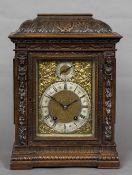 A Victorian walnut cased eight day bracket clock The acanthus carved domed top above the silvered